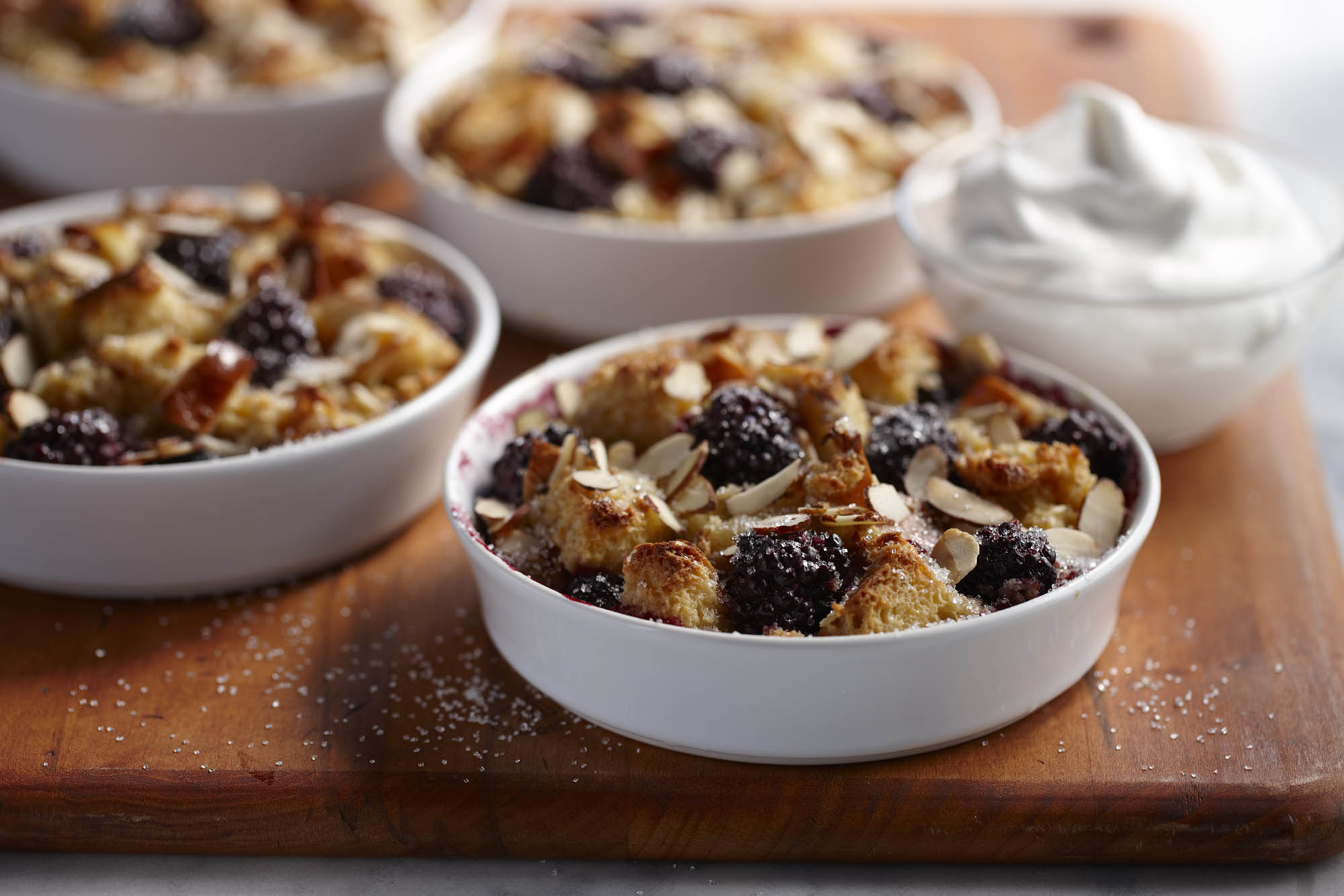 Cups of blackberry almond bread pudding 