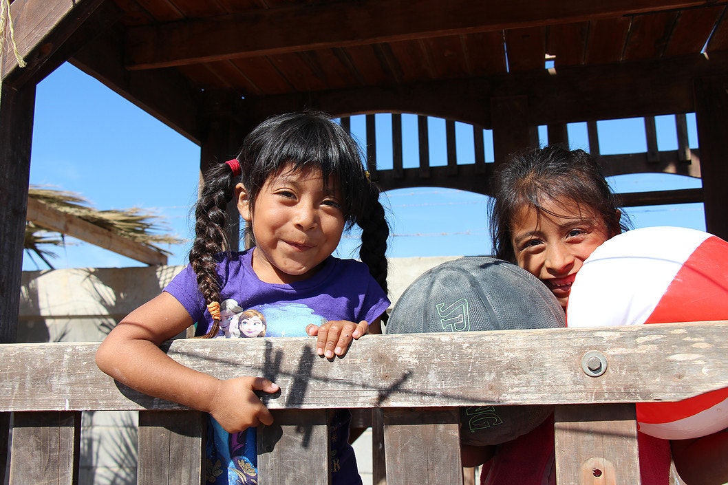 Two girls with basketballs