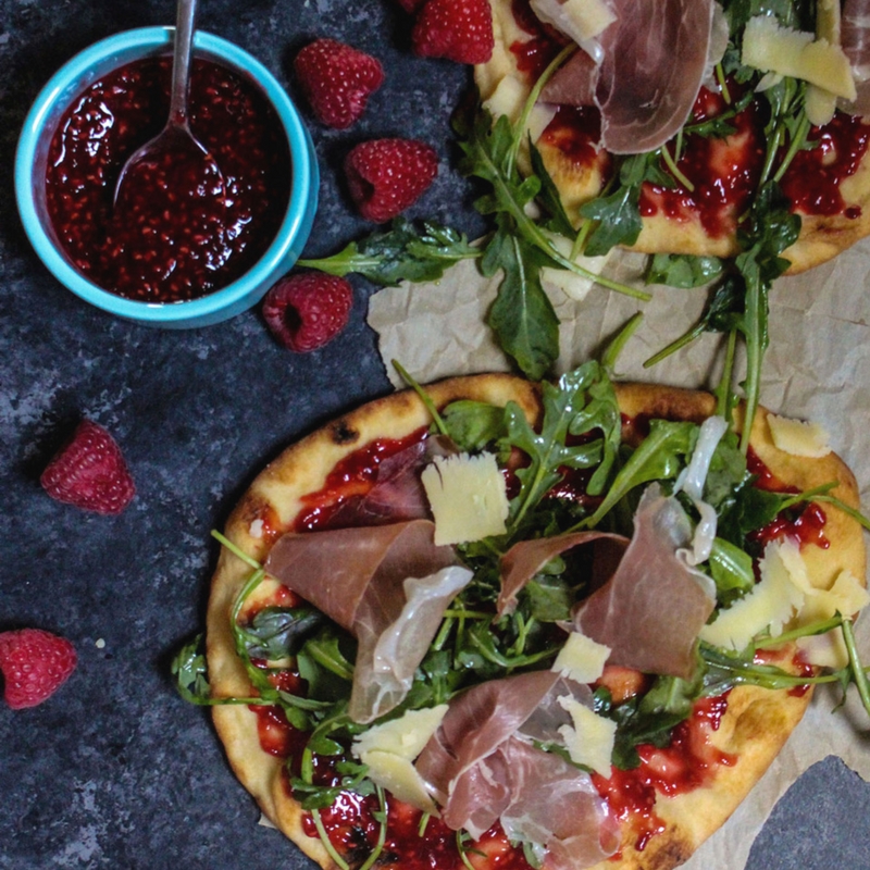 Prosciutto-arugula flatbread with homemade raspberry jam